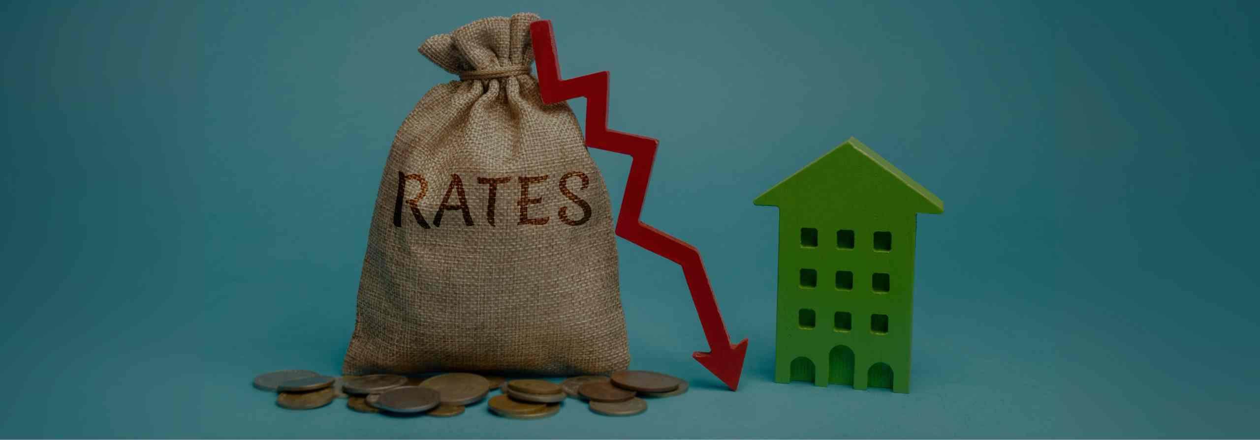 A burlap bag with Rates written on it next to a red arrow pointing down and a green Scottsdale home for sale